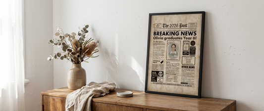 Framed personalised graduation gift print styled on a timber sideboard with dried eucalyptus stems in a warm Australian home interior