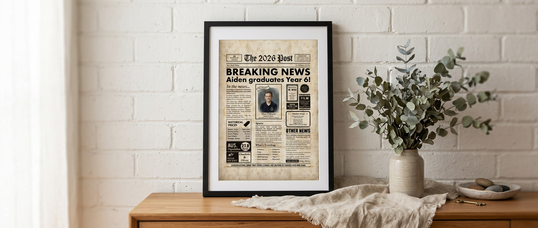 Framed personalised year 6 graduation poster styled on a timber sideboard with eucalyptus stems in an Australian home interior