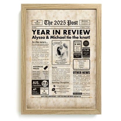 Framed newspaper poster print for a first anniversary, featuring the year 2025 in review.