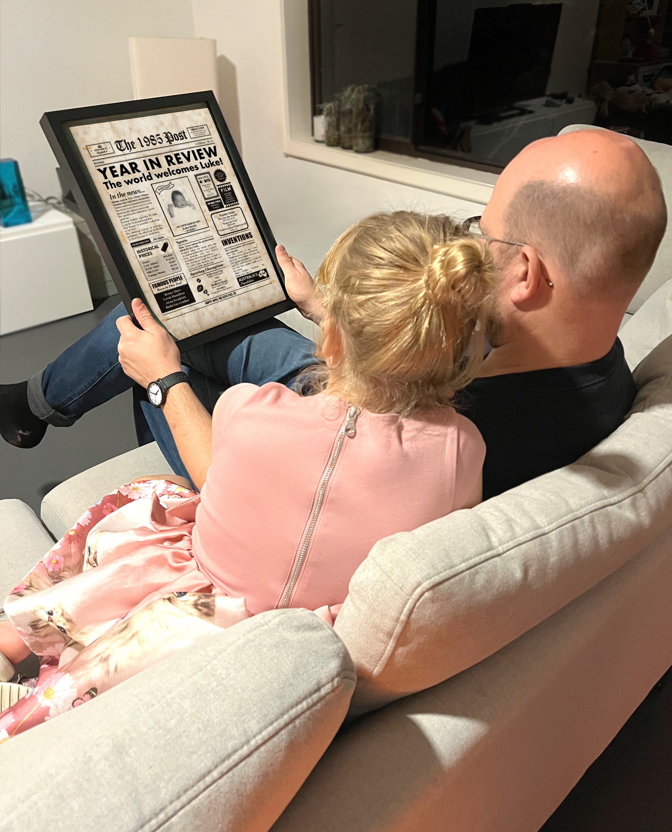 Looking at birthday newspaper